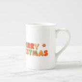 サンタ帽をかぶった元気な漫画の犬 ボーンチャイナマグカップ (右)