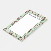 サンタ帽を被ったペンギンたちが耳にイヤホンつけてやることリストをチェックしてる ポストイット (アングル)