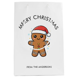 サンタ帽子のキュートなジンジャーブレッドマンクリスマス ミディアムペーパーバッグ