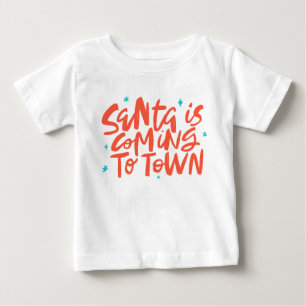 サンタ来イズトゥタウンホリデイデザイン ベビーTシャツ
