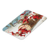 サンタ格言が丸太に滑る マグネット (左側)