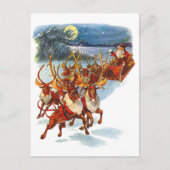 サンタ飛んでいるクロースとトナカイの誘導そり シーズンポストカード (正面)