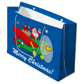 サンタ飛んでいるクロースと贈り物でいっぱいの飛行機 ラージペーパーバッグ (正面アングル)