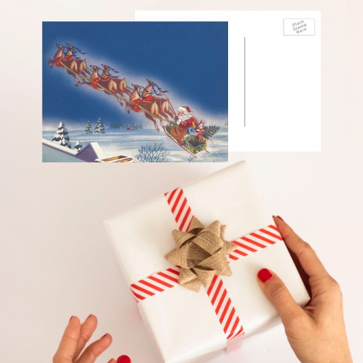 サンタ飛んでいるスレイwトナカイ シーズンポストカード