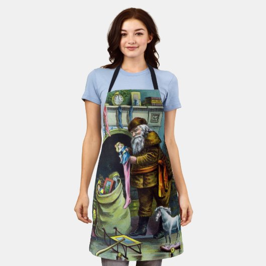 サンタ・クラウスのヴィンテージクリスマスのおもちゃつきストッキング エプロン (着用した状態)