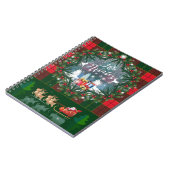 サンタ・クロースはトナカイが率いる木馬に乗っている ノートブック (左側)