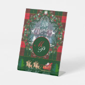 サンタ・クロースはトナカイが率いる木馬に乗っている 台座サイン (正面)