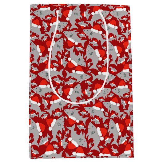 サンタ・シャークのクリスマスレッド背景 ミディアムペーパーバッグ (正面)