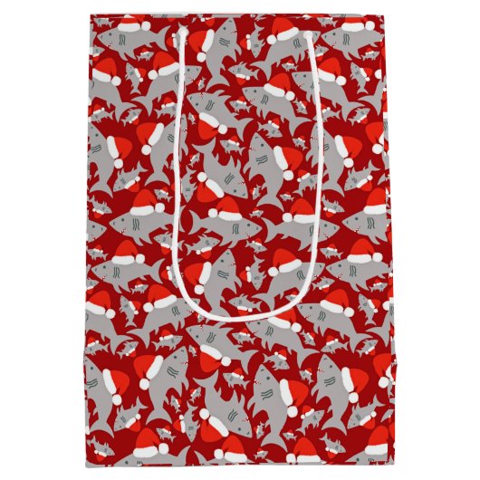 サンタ・シャークのクリスマスレッド背景 ミディアムペーパーバッグ (裏面)