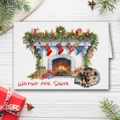 サンタ・暖炉でドイツの羊飼い子犬が待つ