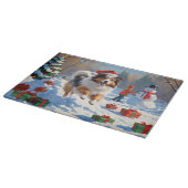 シェットランド走シェプドッグのクリスマス帽で雪 カッティングボード (角)