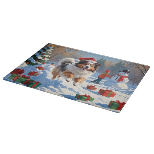 シェットランド走シェプドッグのクリスマス帽で雪 カッティングボード (角)