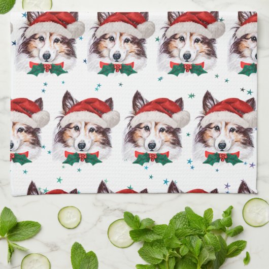 シェットランド・ シープドッグ犬がクリスマススターを育てる キッチンタオル (折り畳み)
