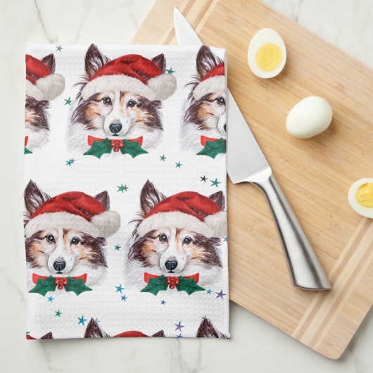 シェットランド・ シープドッグ犬がクリスマススターを育てる キッチンタオル (四つ折り)