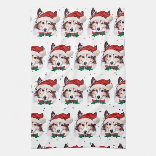 シェットランド・ シープドッグ犬がクリスマススターを育てる キッチンタオル (縦)