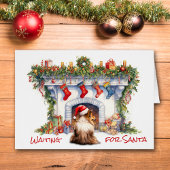シェットランド・ シープドッグ犬がサンタクリスマス暖炉を待つ