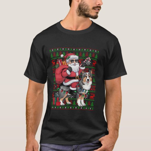 シェルティーに乗るサンタのユーモラスなクリスマス電飾 面白い Tシャツ (正面)