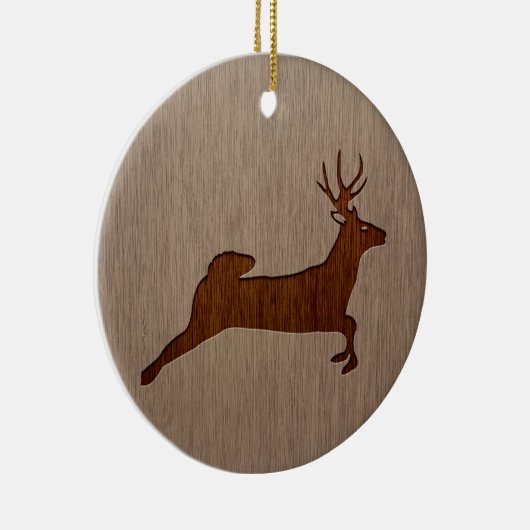 シカは木製のデザインで刻まれてシルエットを描きます セラミックオーナメント (右)