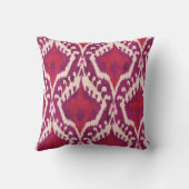 シックで多彩な赤いおよび紫色のイカット種族パターン クッション (裏面)