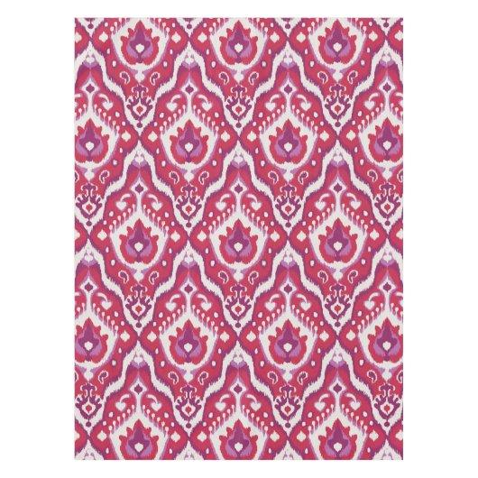 シックで多彩な赤いおよび紫色のイカット種族パターン テーブルクロス (正面)