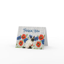 シャム猫の赤と青のケシ