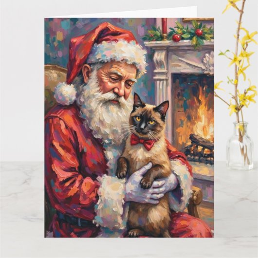シャム猫を抱くサンタクロースのクリスマスアート カード (黄色い花)