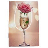 シャンパンフルートでピンクのアニバーサリーバーサリーシーズン ミディアムペーパーバッグ (正面)