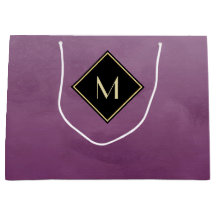 シンプルな金ゴールドのモノグラムとのエレガントなブラシをかけられた紫色