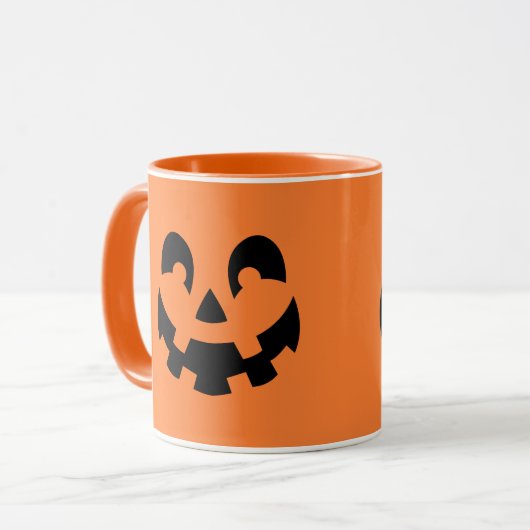 シンプルブラックパンプキン顔オンオレンジハロウィーン マグカップ (正面左)