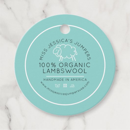 シープウールアクアホワイトブラックニットビジネスクラシック フェイバータグ (正面)