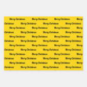 シームレスなメリークリスマス文字オンイエロー ラッピングペーパーシート (正面)