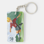 ジェイThrockmorton著球を蹴っているサッカーの選手 キーホルダー (裏面)