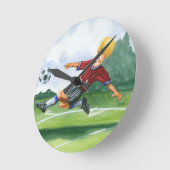 ジェイThrockmorton著球を蹴っているサッカーの選手 ラウンド壁時計 (傾斜)