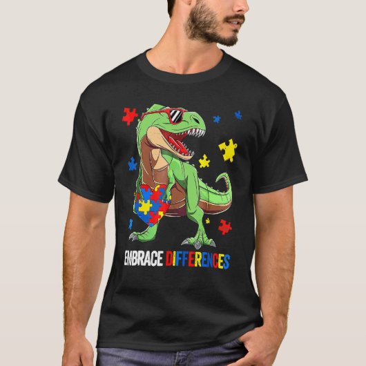 ジグソーパズルのピース 自閉症 T-Rex 恐竜 差異を受け入れる Tシャツ (正面)