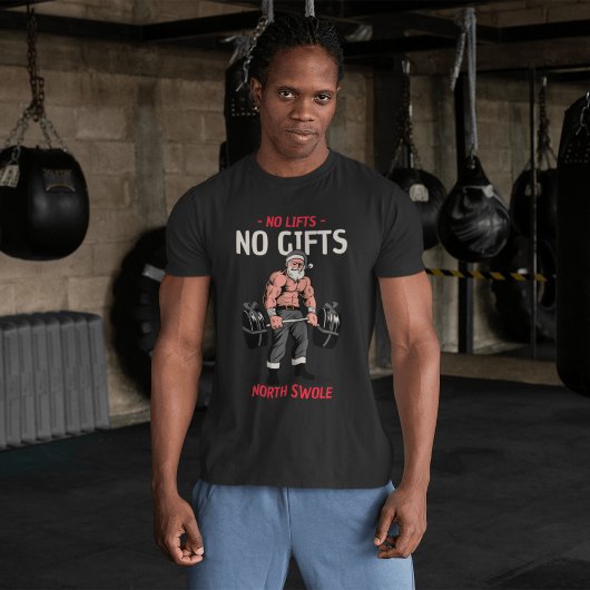ジムをテーマにした腫れたサンタクロースがバーベルを持ち上げる Tシャツ