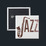 ジャズタイポグラフィサックス 缶バッジ<br><div class="desc">タイポグラフィデザインは、サックスのシルエットを文字「J」とした「ジャズ」文字を特徴とする</div>
