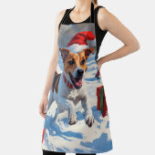 ジャックラッセル走がクリスマス帽子と雪に降りてくる エプロン (インサイチュ)