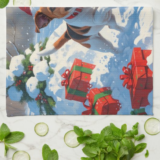 ジャックラッセル走がクリスマス帽子と雪に降りてくる キッチンタオル (折り畳み)