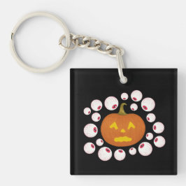 ジャック・オ・ランタンのカボチャと闇の中の眼球 キーホルダー