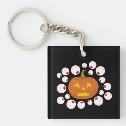 ジャック・オ・ランタンのカボチャと闇の中の眼球 キーホルダー (正面)