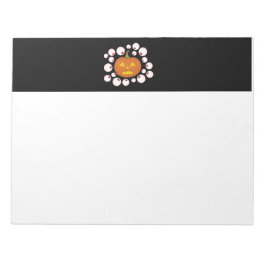 ジャック・オ・ランタンのカボチャと闇の中の眼球 ノートパッド