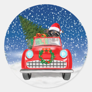 ジャック・ラッセル・テリアが雪の中で車を運転するクリスマス ラウンドシール