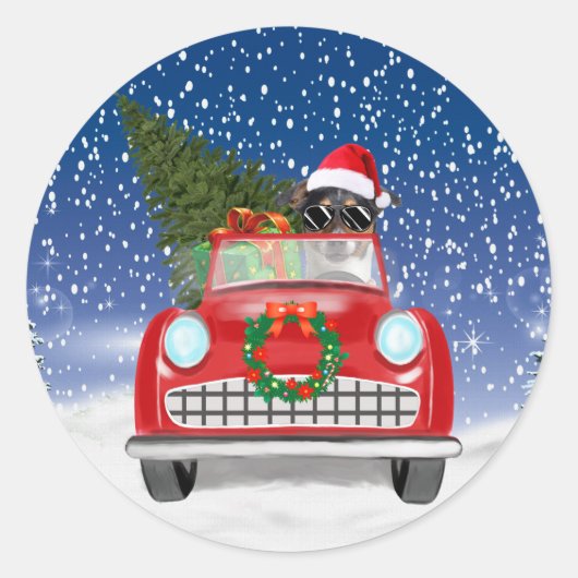 ジャック・ラッセル・テリアが雪の中で車を運転するクリスマス ラウンドシール (正面)