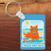 ジンジャーの猫がビーチでくつろぐ 夏と海が恋しい キーホルダー (正面)