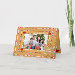 ジンジャーブレッドマンによって折られる写真のクリスマス シーズンカード