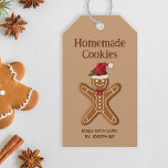 ジンジャーブレッドChristmas Cookie – 自家製Cookie ギフトタグ<br><div class="desc">この救済ラベルを使って、クッキーが自家製であることを知らせることができる。このデザインは、サンタハットと赤い弓を持つ茶色のジンジャーブレッドクッキーのデステイのフェスティバルイラストレーションを特徴としている。背景色は薄茶色。また、パーソナル化可能な文字領域が2つある。</div>