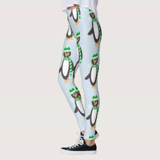 スカーフを着たペンギンの漫画の文字パターン レギンス (左)