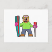 スキーとスキーポールを持つスキーヤーとしてベア ポストカード (正面)