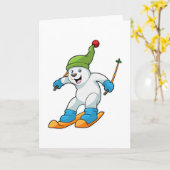 スキーとボブルハットを持つスキーヤーとしての北極熊 カード (黄色い花)