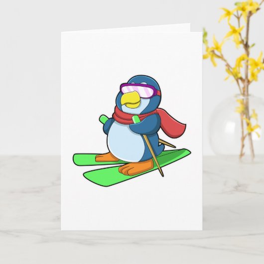 スキーウェアとスキー用マフラーとサングラスを着たペンギン カード (黄色い花)